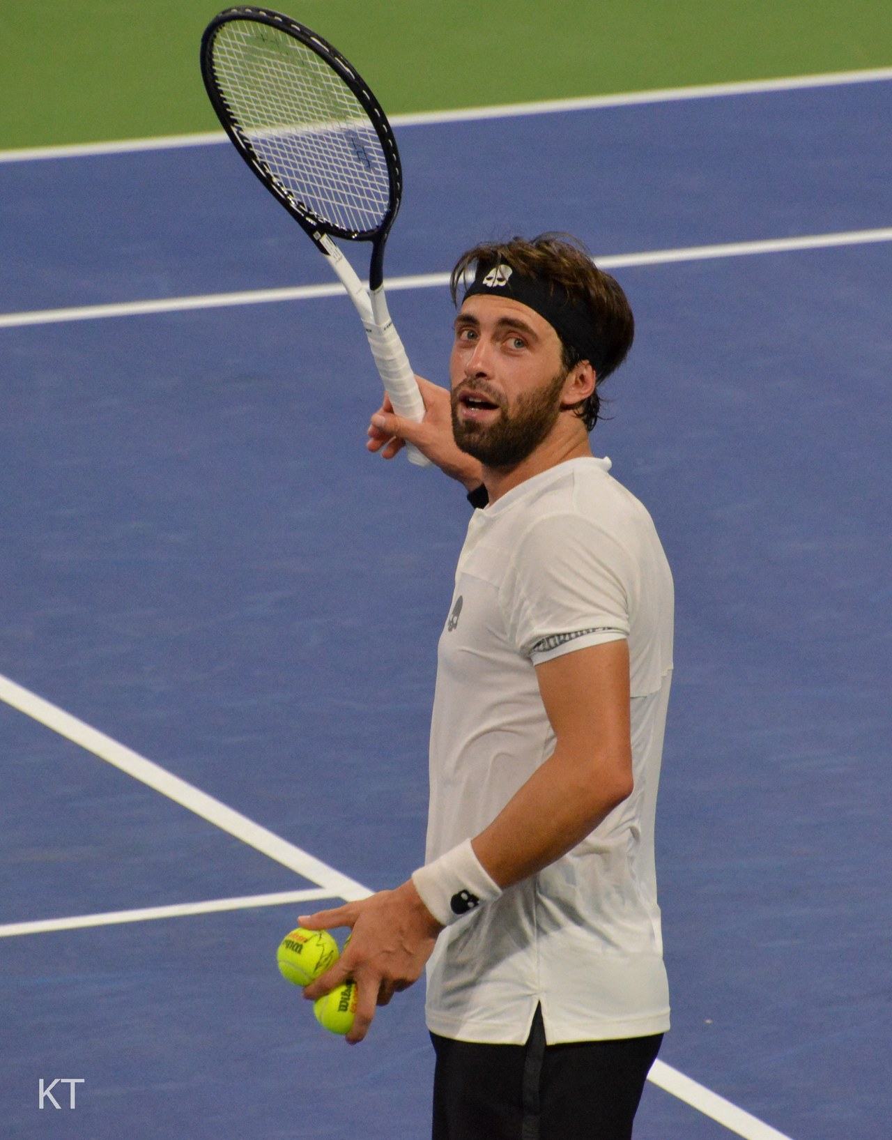 Nikoloz Basilashvili hitting balls to the crowd after a US Open match