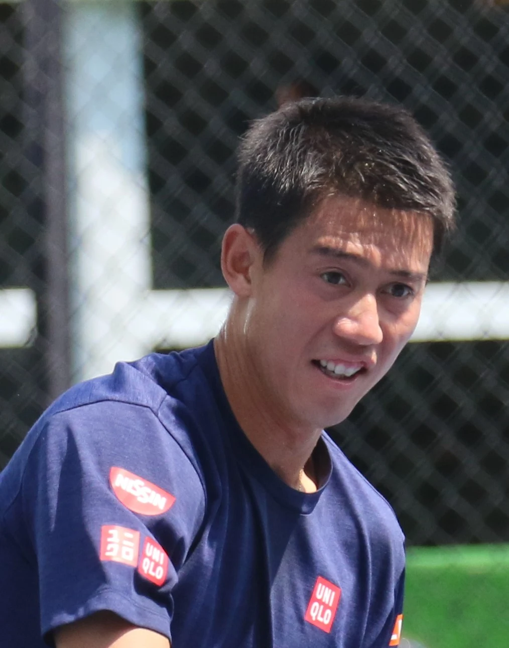 Kei Nishikori neben dem Zaun eines Trainingsplatzes bei den Citi Open 2018